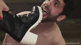 The muscled dominatrix beats and humiliates her slaveboy in a fierce wrestle