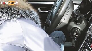 A girl unbuttoned the pants of a man because of the heat in the car