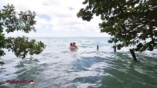 A couple enjoys amazing sex in the scenic blue lagoon, a perfect outdoor setting