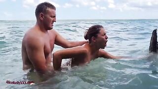 A couple enjoys amazing sex in the scenic blue lagoon, a perfect outdoor setting