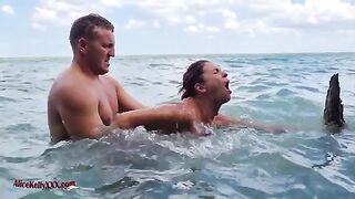 A couple enjoys amazing sex in the scenic blue lagoon, a perfect outdoor setting