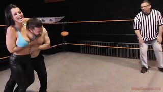 Nadia White, the busty brunette, dominates her opponent in a fierce match