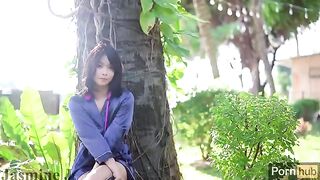 The Asian girl has a garden where she likes to play with toys