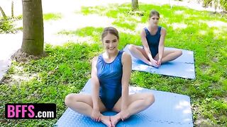 Gymnast is stretching with her coach when her friend surprises them both