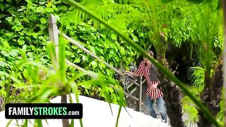Two young girls, Kiara and Gianna, have a playful 4th of July moment