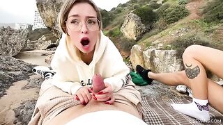 Two pretty girls in their early youth have fun on the beach with guys