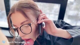 A hot slut talking on the phone with her husband while her friend fucks her