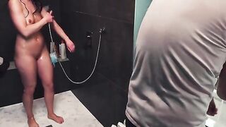 A hot brunette gets her dick washed down the drain in the shower