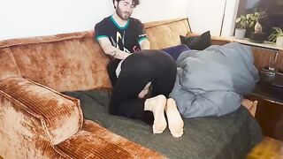 A couple has an intense encounter under the blanket, reaching a powerful climax