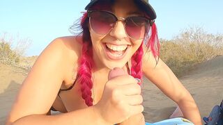 A girl is flashing her body on the beach