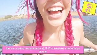 A girl is flashing her body on the beach