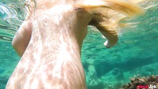 Babe JessiJek fucks on the beach and in the water, showcasing her amazing big ass