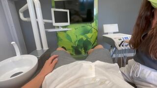 Patient and dentist engage in intense action at the dentist's office