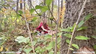 A little girl in a red riding hood costume is fucking with a big bad wolf in public