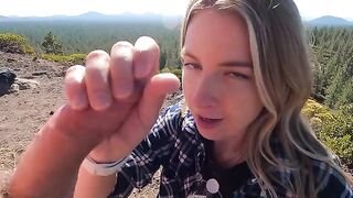 Blonde makes blowjob on the top of the mountain riskily