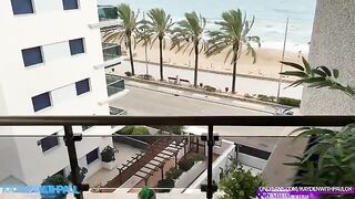 A couple engages in public sex on the balcony, right by the sea