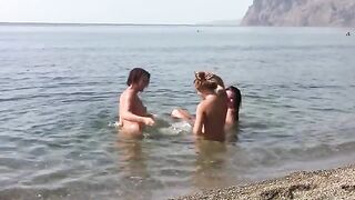 Three naked beauties on the coast, enjoying the breeze without clothes