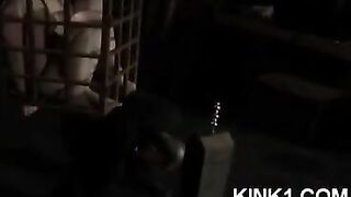The slave is in a cage and fulfills all the orders of the master