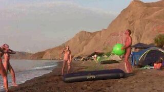 A hot naked game of badminton on the nude beach
