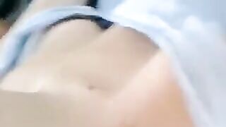 A half-naked lie and body strokes with her hands