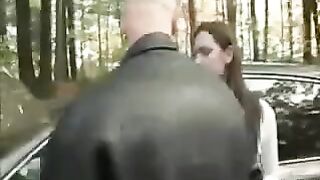 A woman was placed on the car's bonnet and started to be torn