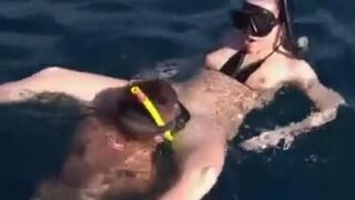 Two aqua sex workers have underwater sex right in the sea
