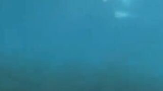 Two aqua sex workers have underwater sex right in the sea