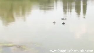 A brunette girl showed her friend's boyfriend her tongue on the pier
