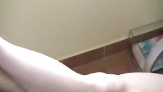 A naked girl has a smoke and gets burned