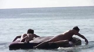 Nude beauties have sex on the sandy beach