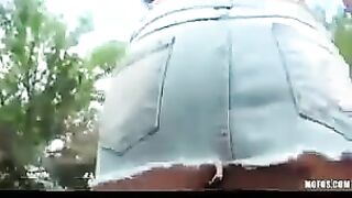 A hot brunette girl plays with herself on the street and shows it to the camera