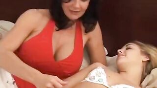 Hot lesbian sex with a big ass MILF using a strap-on dildo