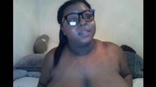 A black woman with big natural tits closed the camera