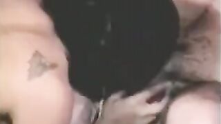 A guy fucked by a strapon, while another girl fingers his cock with her hand