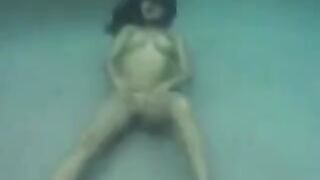 Sex on the coast of the ocean with a busty brunette