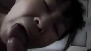An experienced Chinese woman teaches her guy how to perform a blowjob