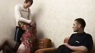 A mature woman fucked by her son and his friend in this hot vid