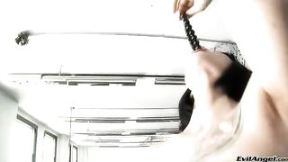 A girl plays with a ball and masturbates wearing sexy high heels