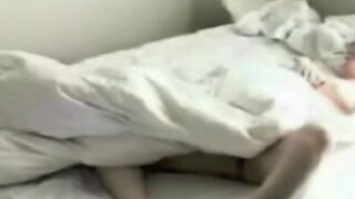 A hidden camera captured intimate moments in the bedroom while indulging in self-pleasure