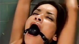 The bald guy fucked a girl tied up with sex machine