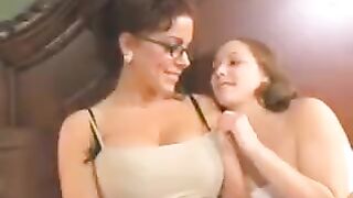 A sweet moment of a mother and daughter sharing a bed together