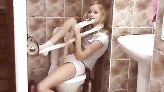 The blonde does not expect visitors in the public toilet and is surprised