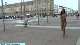 A chick goes for a walk in the city without any clothes