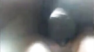 A black girl caresses herself, showcasing her wet pussy and intense orgasmic reactions