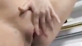A man made cumshot right at the pregnant belly of a brunette