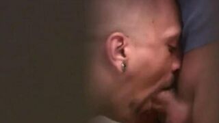 Two guys are jerking off each other in a public toilet