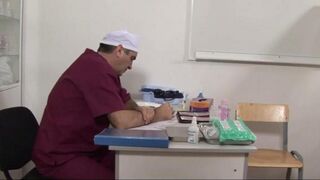 The doctor expanded the pussy of a patient with a speculum