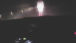 A sexy woman was exercising when a strange figure appeared