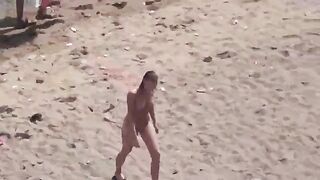 A pair of naked lovers have fun on the sea