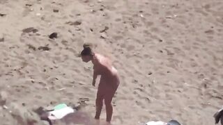 A pair of naked lovers have fun on the sea